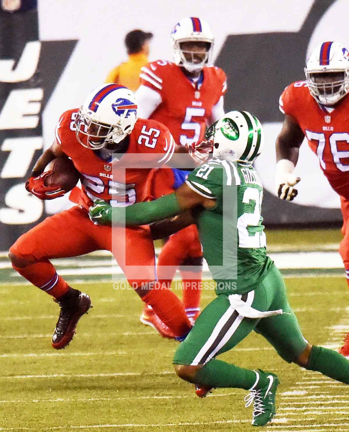 Buffalo Bills running back LE SEAN MCCOY runs through the arms of New York Jets free safety MARCUS GILCHRIST for a first down in the first quarter at MetLife Stadium. LE SEAN MCCOY ran for 112yards leading the Bills to a 22-17 victory over the New York Jets.