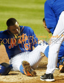 New York Mets outfielder YOENIS CESPEDES hits a foul tip off of his left knee
