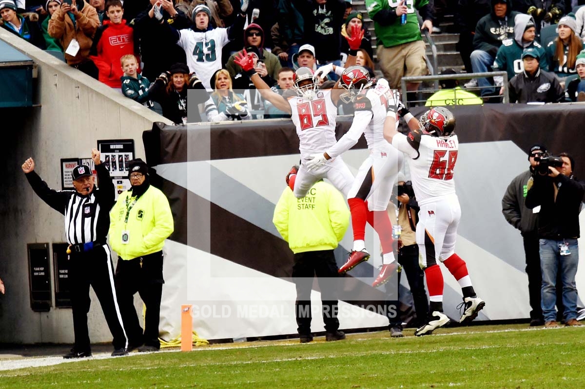 Tampa Bay Buccaneers MIKE EVANS, RUSSELL SHEPARD, and JOE HAWLEY celebrate a touchdown scored by MIKE EVANS in the first quarter against the Philadelphia Eagles tying the game 7-7. The Buccaneers went on to win 45-17.