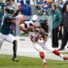 Tampa Bay Buccaneers running back DOUG MARTIN stiff arms Philadelphia Eagles cornerbck NOLAN CARROLL at the end of an 84 yard run in the second quarter at Lincoln Financial Field. MARTIN ran for 235 yards, leading the Buccaneers to a 45-17 victory over the Eagles.
