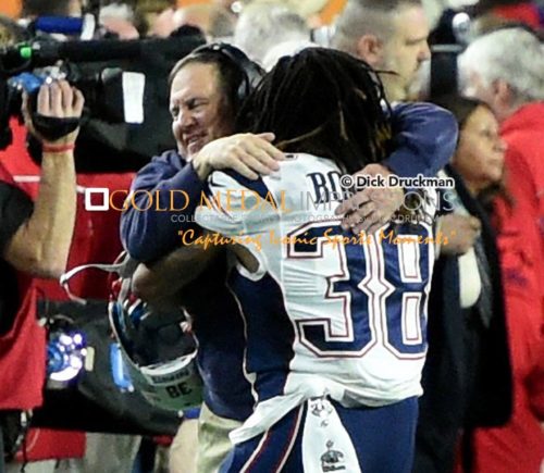 New England Patriots head coach, BILL BELICHICK, gets a victory hug from running back BRANDON BOLDON after defeating the Seattle Seahawks 28-24 in Super Bowl XLIX.