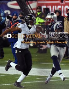 New England Patriots wide receiver, BRANDON LAFELL, scores winning touchdown in the fourth quarter against the Baltimore Ravens, as Ravens' cornerback, MELVIN RAASHAN attempts to defend. The Patriots defeated the Ravens 35-31.