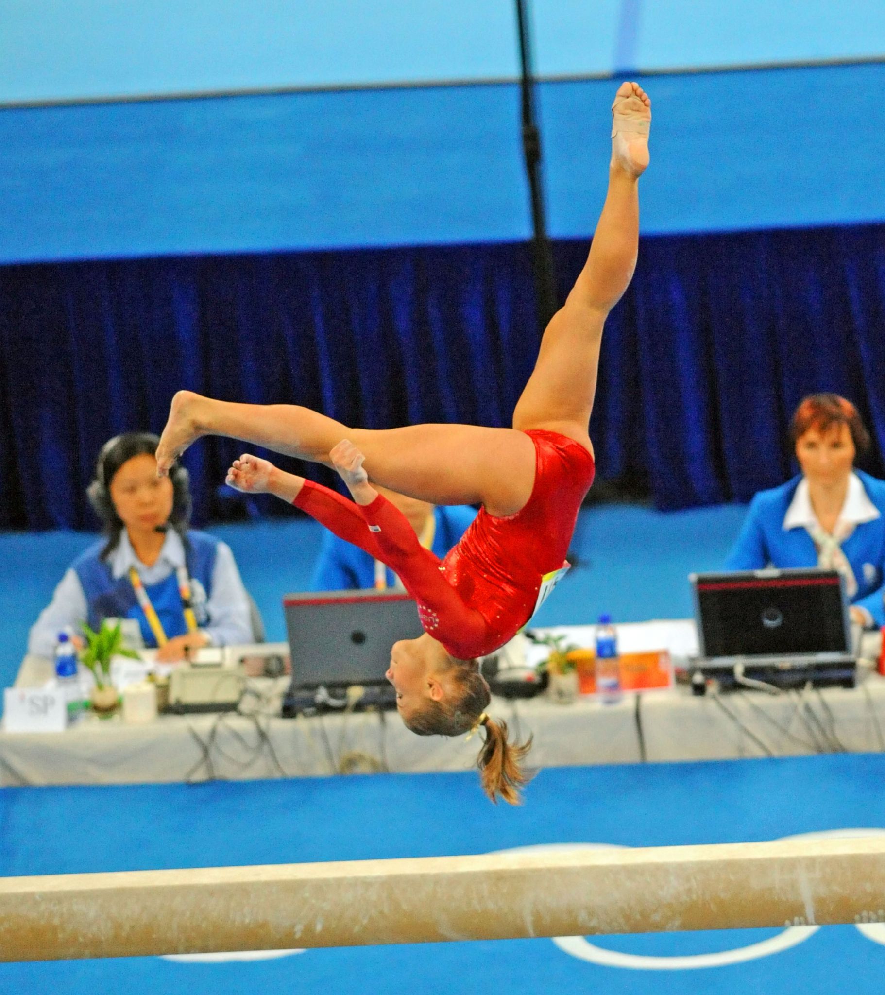 USA gymnast Shawn Johnson does a somersault on the balance beam at the