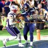 With just seconds remaining in the first half of Super Bowl XLVI, Seattle Seahawks wide receiver CHRIS MATTHEWS scores a touchdown pass as Boston Patriots cornerback LOGAN RYAN attempts to defend. The Patriots went on to win 28-24.