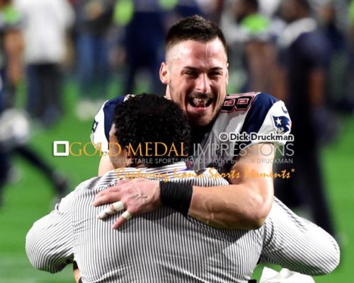 New England Patriots wide receiver, DANNY AMENDOLA, who scored one of the teams touchdowns hugs coach after winning Super Bowl XLIX. The Patriots defeated the Seahawks 28-24.