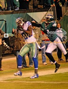 DEZ BRYANT catches his second of three touchdown passes against Philadelphia Eagles cornerback BRADLEY FLETCHER. The Eagles went on to win 38-27.