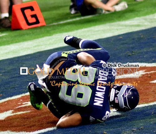 Seattle Seahawks wide receiver DOUG BALDWIN scores a touchdown against the New England Patriots in the third quarter of Super Bowl XLVI. The Patriots went on to win 28-24.