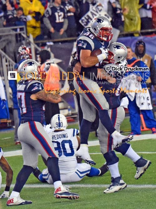 New England Patriots running back JAMES DEVELIN celebrates scoring a touchdown with offensive lineman,RYAN WENDELL, in the first quarter of the AFC championship game at Gillette Stadium in Foxboro, Massachusetts. The Patriots went on to win 45-7.