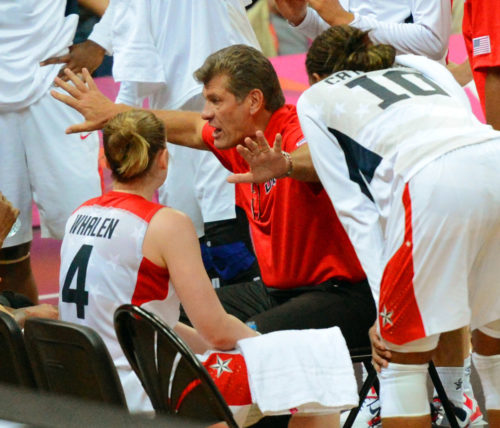 USA olympic women's basketball team head coach, Geno Auriema, makes a point in the team huddle in the fourth quarter quarter final game against Canada. The USA team went on to defeat Canada 91-48.(AP Photo/Dick Druckman)