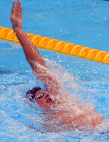 USA swimmer Ryan Lochte leads in the men's 400m Individual Medley final in the Backstroke leg of the competition. Lochte went on to win the Gold Medal.(AP Photo/Dick Druckman)
