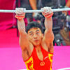 China gymnist, Zhe Feng, eyes the horizontal bar in the team competition on the London Olympics. China went on to wn the gold medal.