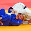 Lucie Decosse(white)from France throws Thiele Kerstin(Blue)from Germany in the women's final judo competition in the London Olympics. Lucie Decosse won the gold medal.(AP Photo/Dick Druckman)