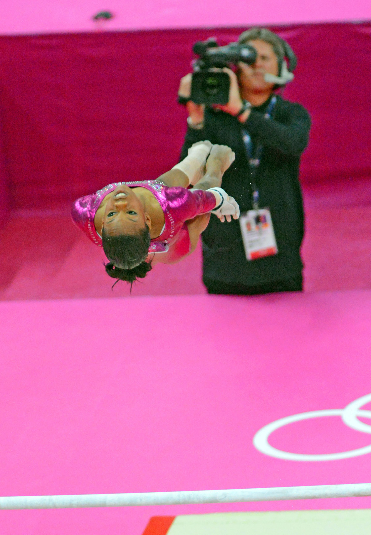 USA gymnist Gabrielle Douglas flies like a bird while performing on the uneven bars in the women's individual all-around competition in the London Olympics. Gabby won the gold medal.