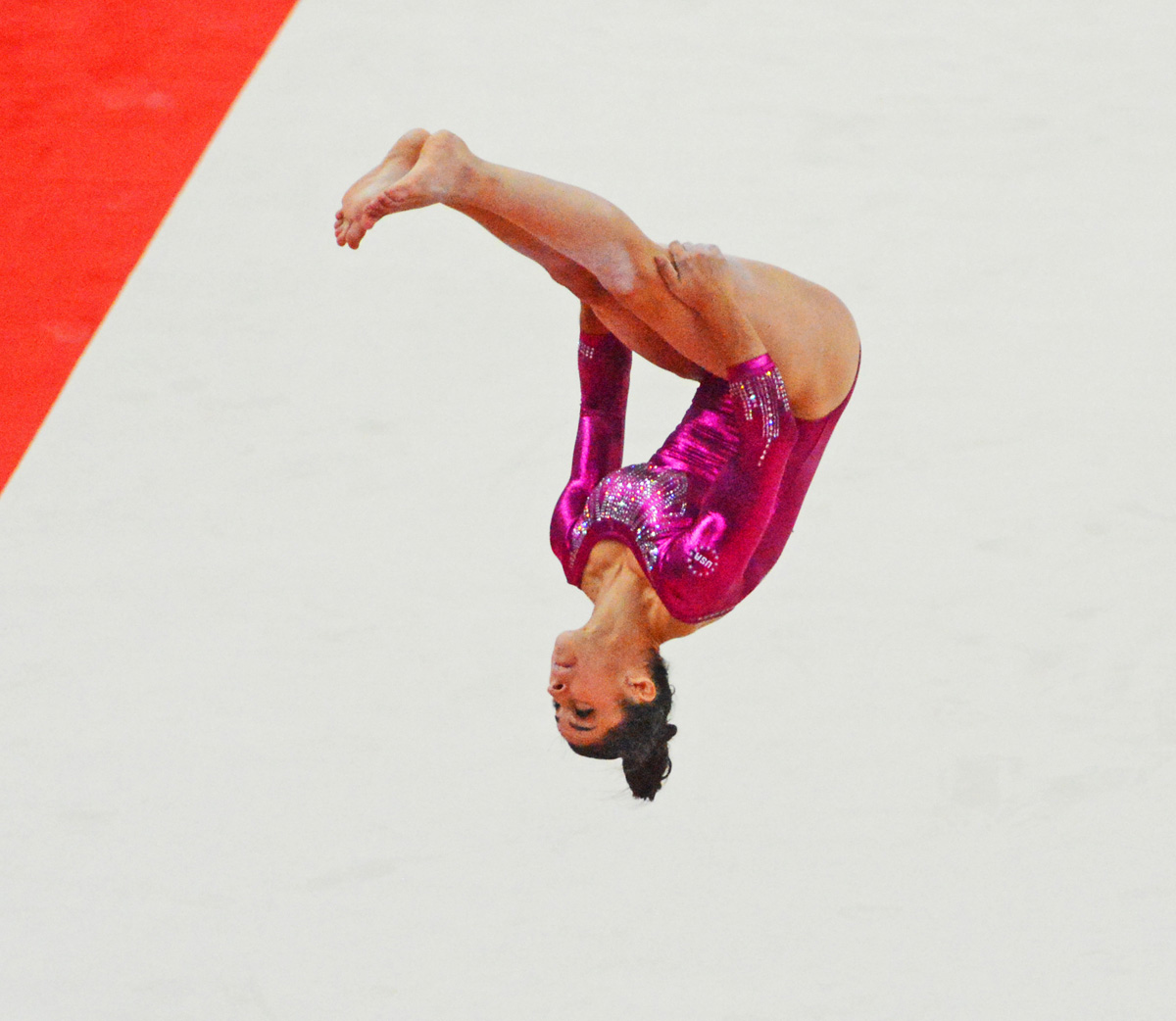 USA gymnast Aly Raisman showcasing her skills on the floor exercise during the 2012 Summer Olympics in London England.