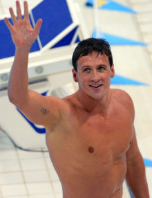 USA swimmer, Ryan Lochte, waves to the crowd after winning the Gold Medal in the Men's Individual Medley Final in the London Olympics. Ryan easily defeated Michael Phelps who earned a fourth place in the event.(AP Photo/Dick Druckman)