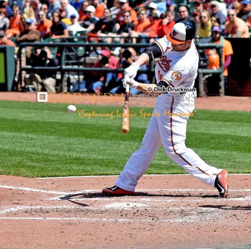 Baltimore Orioles first baseman, CHRIS DAVIS, doubles in the third inning off of Boston Red Sox starting pitcher WADE MILEY, driving in two runs. DAVIS went 3 for 5, driving in 3 runs, scoring 3 runs and leading the Orioles to a 18-7 victory over the Red Sox.(AP Photo/Dick Druckman)
