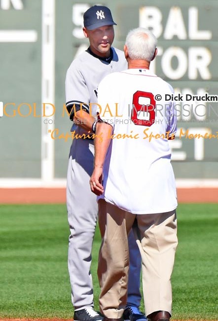 Boston Red Sox legend, Carl Yazstremski, shakes hands with Derek Jeter as part of the farewell ceremony prior to Derek Jeters last game of his career played at Fenway Park. Derek ended his career going 1 or 2, driving in a run and leading the Yankees to a 9-5 victory