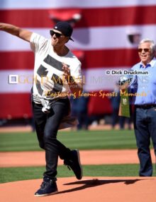 New England Patriots Super Bowl MVP quarterback, TOM BRADY, throws out the first pitch of the Boston Red Sox home opener as Patriots owner ROBERT KRAFT, looks on. The Red Sox went on to defeat the Washington Nationals 9-4.(AP Photo/Dick Druckman)