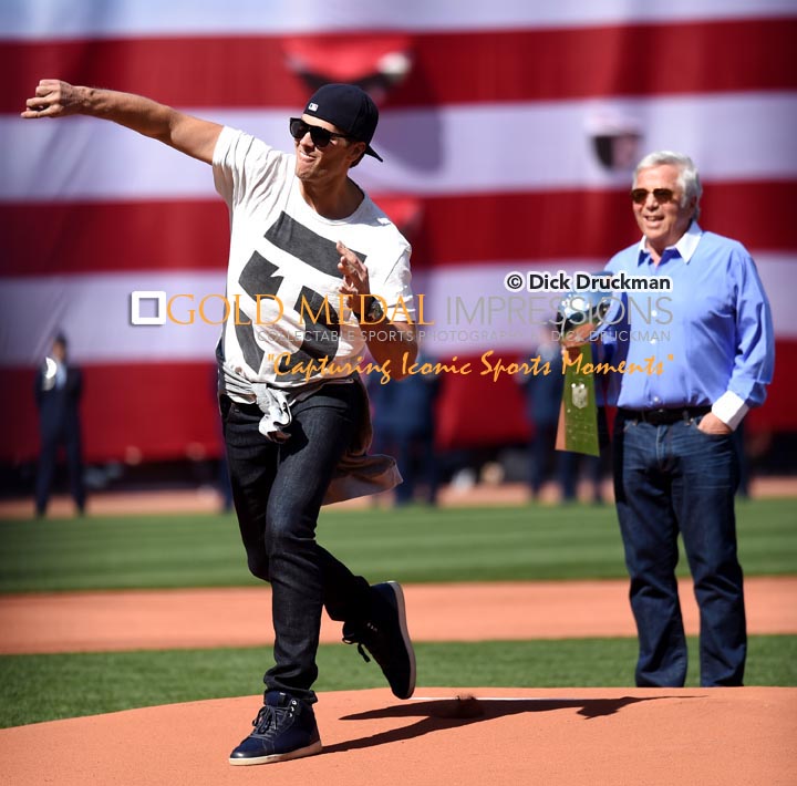 New England Patriots Super Bowl MVP quarterback, TOM BRADY, throws out the first pitch of the Boston Red Sox home opener as Patriots owner ROBERT KRAFT, looks on. The Red Sox went on to defeat the Washington Nationals 9-4.(AP Photo/Dick Druckman)