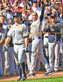 In an historic moment, New York Yankees captain, Derek Jeter, waves goodby to the Boston Red Sox crowd after hitting a single and driving in a run for his 3, 465th hit and the final time at bat of his career.