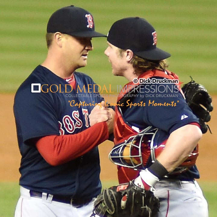 Boston Red Sox relief pitcher, STEVEN WRIGHT, is congratulated by his catcher, RYAN HANIGAN, after defeating the New York Yankees in the 19th inning 6-5. WRIGHT, who was originally slated to be the starting pitcher on Saturday, was called to relieve when the Red Sox ran out of relievers. WRIGHT pitched 5 innings, alloiwing 6 hits 2 runs with 1 strike out but getting the win and the save.(AP Photo/Dick Druckman)