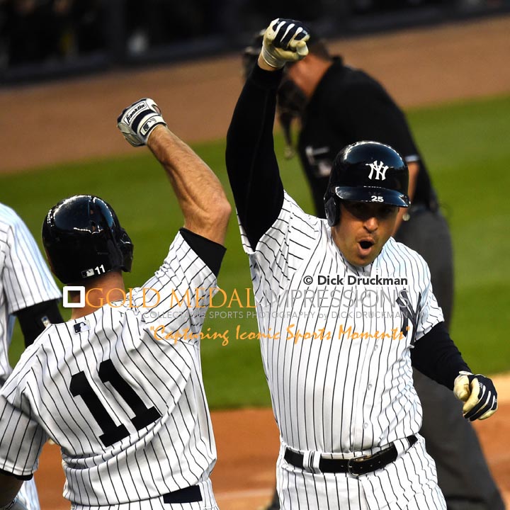 New York Yankees first baseman, MARK TEIXEIRA, celebrates with BRETT GARDNER after hitting a two run home run in the first inning against the New York Mets in the first game of the Subway Series. TEIXEIRA went on to hit a second two run home run in the third inning, leading the Yankees to a 6-1 victory.(AP Photo/Dick Druckman)