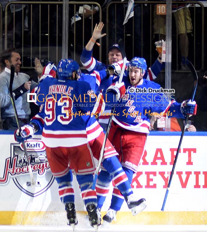 New York Rangers rookie, KEVIN HAYES, celebrates with his teammates after scoring a goal in the second period against the Washington Capitals. The Rangers went on to win 2-1 and now move on to face the Tampa Bay Lightening.(AP Photo/Dick Druckman)