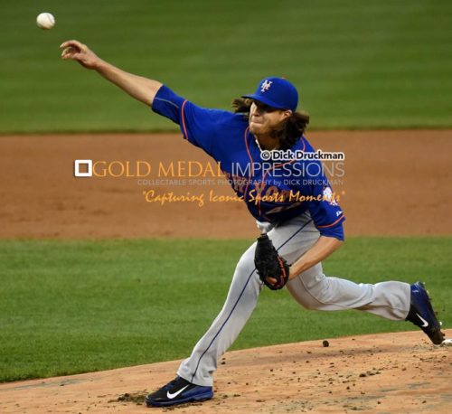 New York Mets starting pitcher, and Rookie of the Year in 2014, JACOB deGROM throws a strike in the first inning of the Subway Series against the New York Yankees. In one of his poorest performances of his career, de Grom gave up eight hits and a career high-tying 6 runs in 5 innings, losing to the New York Yankees 6-1. (AP Photo/Dick Druckman)