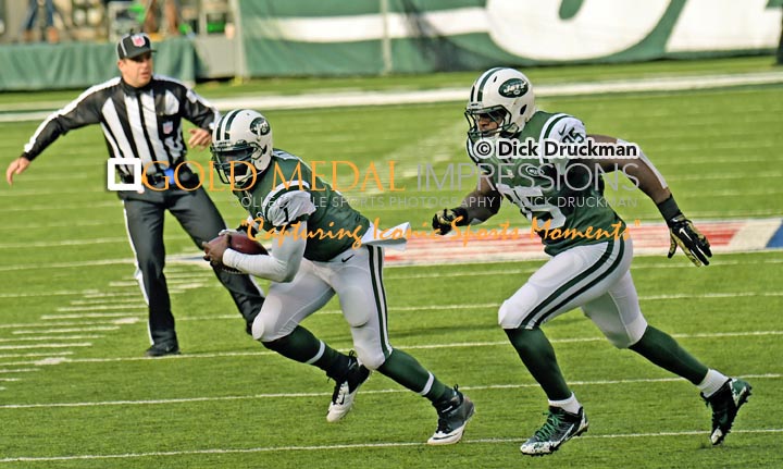 New York Jets quarterback, MICHAEL VICK, runs for an 18 yard first down against the Pittsburgh Steelers in the first quarter at MetLife Stadium. VICK had 8 carries for 39 yards and completed 10 of 18 passes for 132 yards leading the Jets to a 20-13 victory.