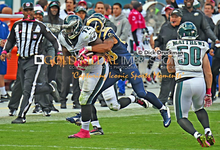 Late in the third quarter, Philadelphia Eagles defensive end Cedric Thornton picks up his second fumble this time by St. Louis Rams running back Zac Stacy and returns it 40 yards to set up a Nick Foles touchdown pass to Jeremy Macliln. The Eagles went on to win 34-28, going 4-1 to start their season.(GOLD MEDAL IMPRESSIONS/Dick Druckman)