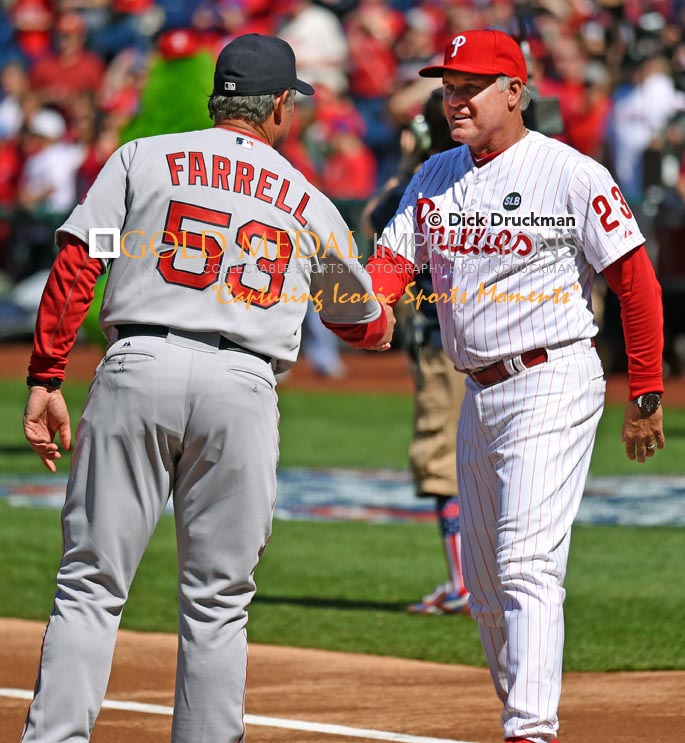 Philadelphia Phillies Manager, RYNE SANDBERG, and Boston Red Sox Manager, JOHN FARRELL, shake hands prior to the Phillies Home Opener at Citizens Bank Park. The Red Sox went on to defeat the Phillies 8-0.(AP Photo/Dick Druckman)