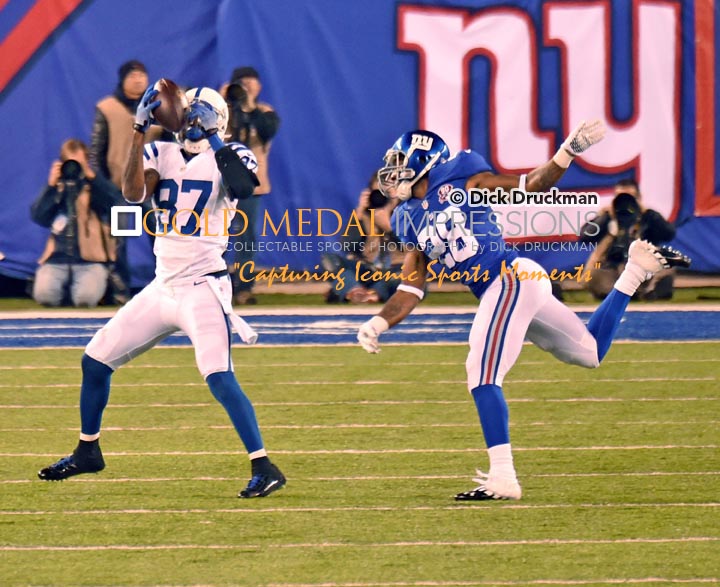 Indianapolis Colts wide receiver, REGGIE WAYNE, catches a 40 yard touchdown pass in the third quarter as New York Giants cornerback, JAYRON HOSLEY is beaten on the play. WAYNE had 4 receptions for 70 yards and one touchdown leading the Colts to a 40-24 victory.