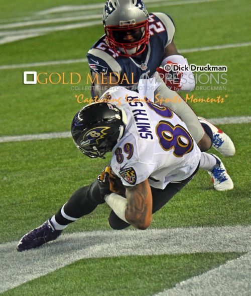 Baltimore Ravens wide receiver, STEVE SMITH SR. catches touchdown pass in the first quarter as New England Patriots cornerback DARRELLE REVIS, attempts to defend giving the Ravens a 14-0 early lead.