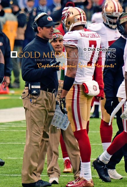 SanFrancisco 49ERS head coach JIM HARBAUGH talks with quarterback COLIN KAEPERNICK on the sidelines in the third quarter against the New York Giants at MetLife Stadium. The 49ERS went on to win 16-10.