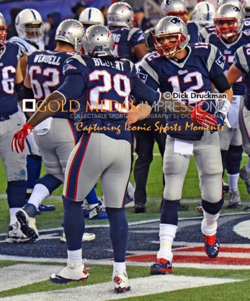 New England Patriots quarterback, TOM BRADY, congratulates running back LE GARRETTE BLOUNT, after he scored the first touchdown of the game against the Indianapolis Colts in the AFC championship game at Gillette Stadium in Foxboro ,Massachusetts. The Patriots went on to win 45-7, earning a trip to Super Bowl 49 against the Seattle Seahawks.