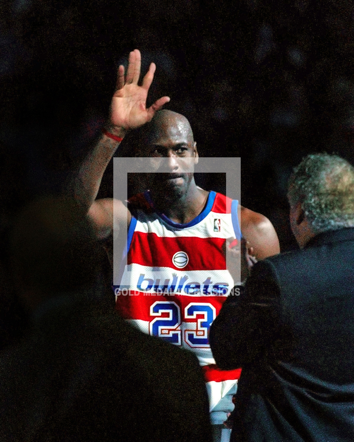Washinton Wizards Michael Jordan waves goodby to his fans after his final home game against the New York Knicks at the MCI Center. Michael scored twenty-one points in a losing effort 79-93.