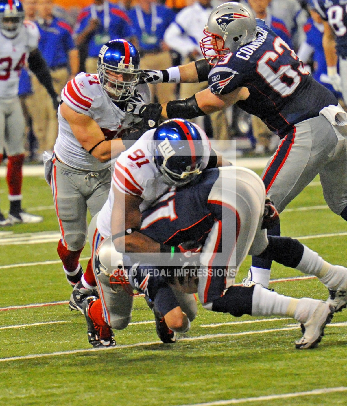 New York Giants defensive end, Justin Tuck, sacks New England Patriots quarterback, Tom Brady,in the third quarter of the Super Bowl. The Giants defeated the Patriots 21-17, winning their fourth Super Bowl and 8th NFL title.(