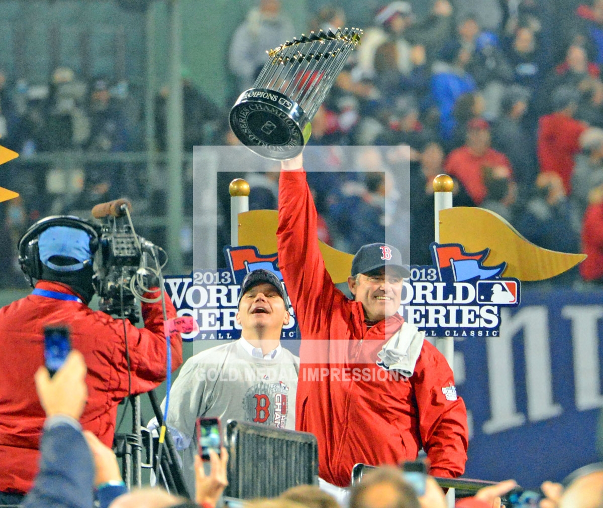 Boston Red Sox manager, John Farrell, holds up the World Series Trophy after winning game 6 by a score of 6-1. The is the first time the Red Sox have won a world series at Fenway Park since 2018