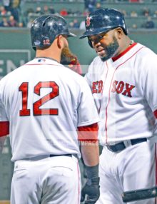 Boston Red Sox designated hitter, David Ortiz(Big Papi) pulls on Mike Napoli's beard as he makes a point in the eighth inning of game 6 if the World Series. Big Papi was selected as MVP of the Series as he went 11 for 16 for a 688 average
