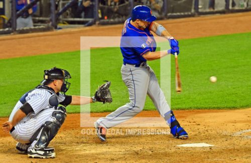 New York Mets third baseman, David Wright, singles in the top of the 4th inning against the New York Yankees driving in a run. Wright had three hits and two RBIs leading the Mets to 12-7 victory in the second game of the Subway Series