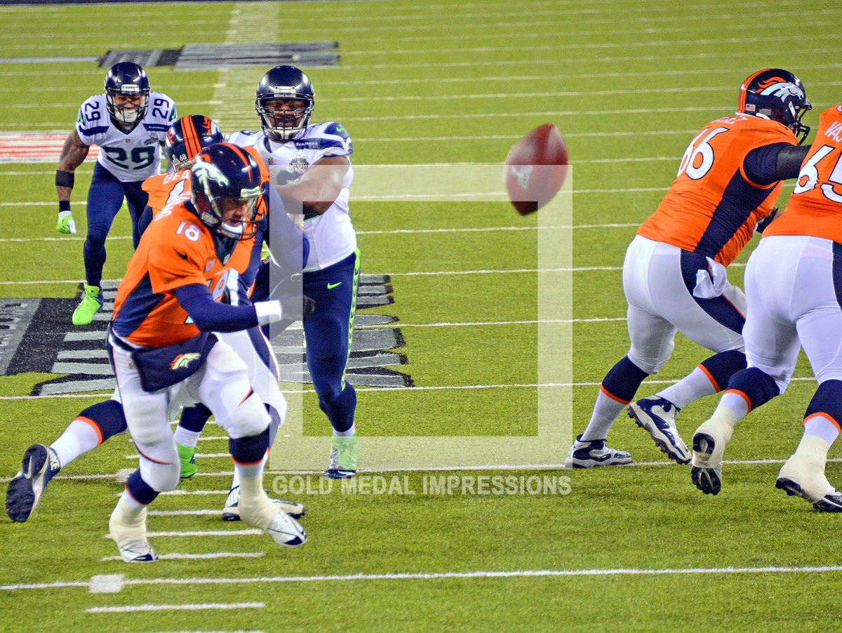 On the first play from scrimmage in Super Bowl XLVIII at MetLife Stadium, Denver Bronco's center Manny Ramirez snaps the ball over the head of quarterback Peyton Manning resulting in a safety for the Seattle Seahawks and the quickets score in Super Bowl history. Unfortunately, for Denver, they never recovered and lost 43-8.(AP Photo/Dick Druckman)