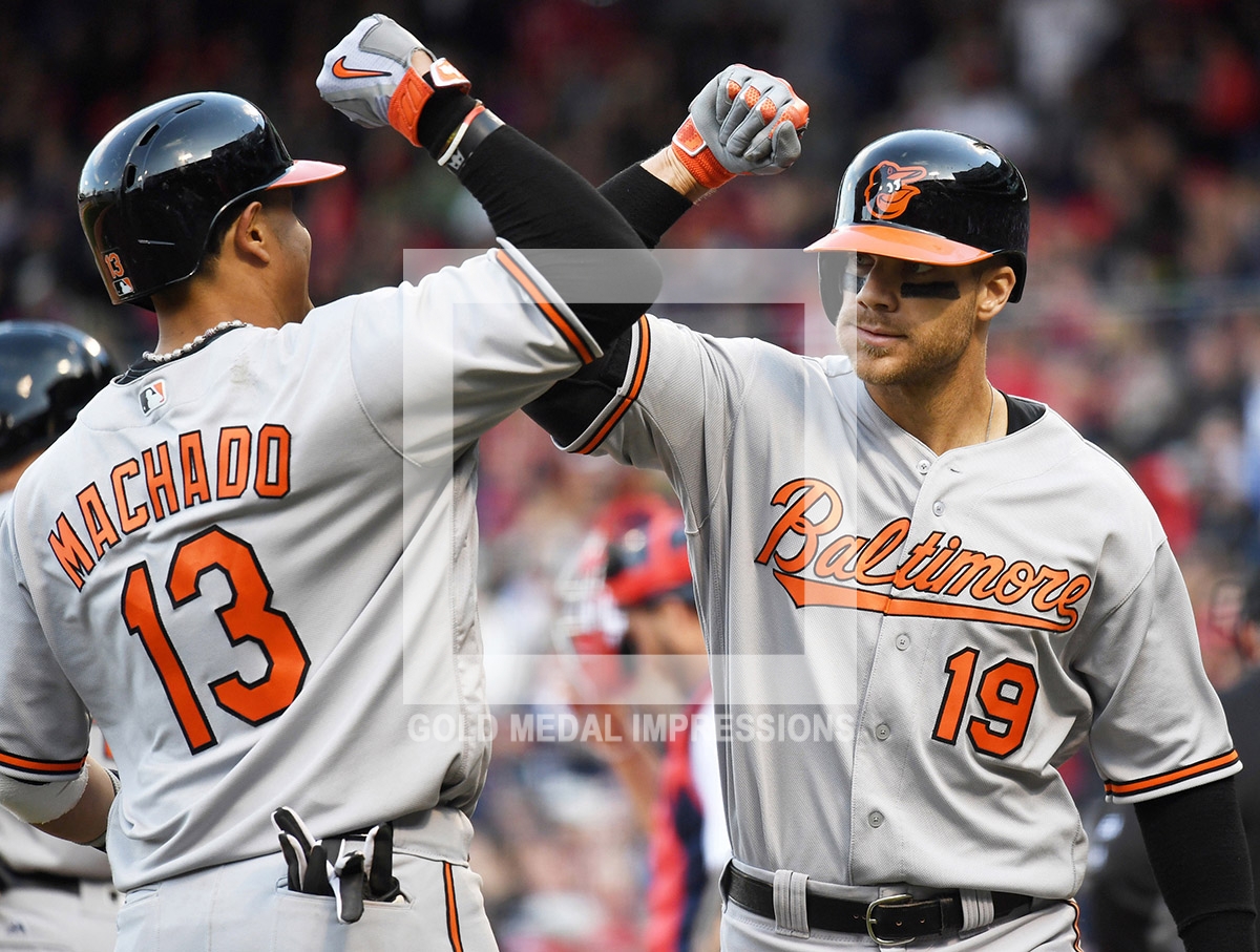 In the crowning moment of the game for the Baltimore Orioles, MANNY MACHADO high fives CHRIS DAVIS after Davis hits a three-run home run in center field off of Boston Red Sox closeer Craig Kimbrel in ninth inning to give the Orioles a 9-7 victory to begin their season 6-0, the best start in Batimore franchise history.