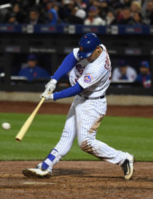 New York Mets outfielder, MICHAEL CONFORTO, singles for his second hit of the inning, driving in the 8th run of the third inning. The Mets went on to win 13-1.