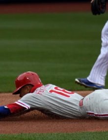 Philadelphia Phillies second baseman, CESAR HERNANDEZ, is tagged out by New York Mets shortstop ASDRUBAL CABRERA while attempting to steal second base in the first inning of the Mets home opener due to an excellent throw by Mets catcher Travis d' Arnaud. The Mets went on to win 7-2.