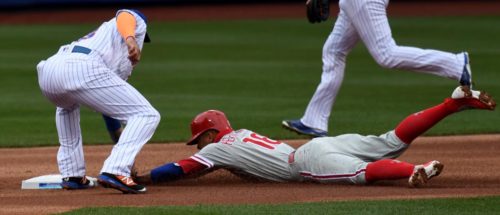 Philadelphia Phillies second baseman, CESAR HERNANDEZ, is tagged out by New York Mets shortstop ASDRUBAL CABRERA while attempting to steal second base in the first inning of the Mets home opener due to an excellent throw by Mets catcher Travis d' Arnaud. The Mets went on to win 7-2.