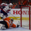 Washington Capitals center, EVGENY KUZNETSOV, scores against the Philadelphia Flyers goaltender, STEVE MASON, in the third period of game three at the Wells Fargo Center. The Capitals went on to win 6-1, taking a 3-0 lead in the series.