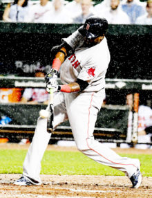 Boston Red Sox designated hitter DAVID ORTIZ hits an RBI double