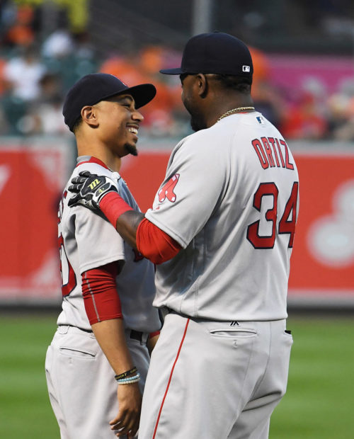 Red Sox DAVID ORTIZ(BIG PAPI) embraces Mookie Betts