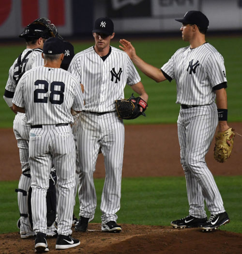 New York Yankees manager JOE GIRARDI takes the ball from BRYAN MITCHELL