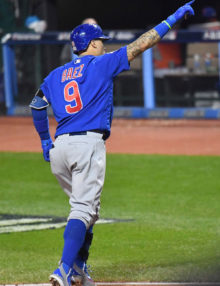 Chicago Cubs shortstop JAVIER BAEZ points to the crowd after hitting a home run